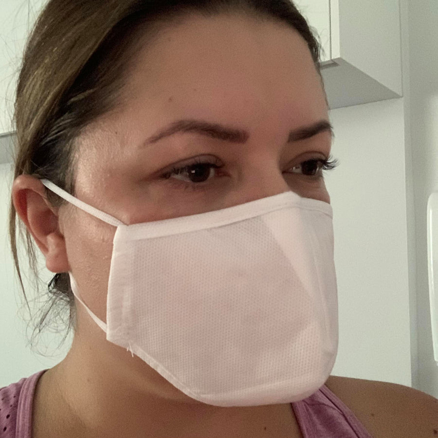 a woman wearing a Lash Tribe KN95 Medical Grade Mask.