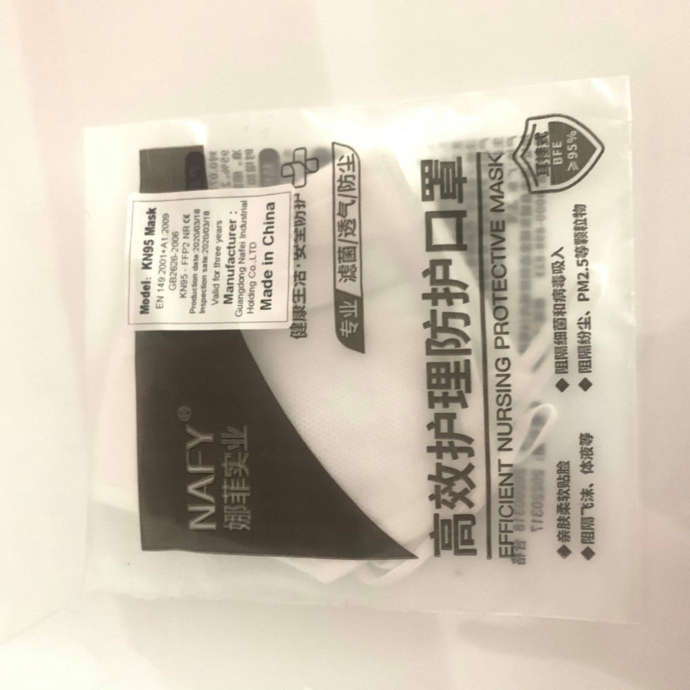 a KN95 Medical Grade Mask with a Lash Tribe brand name on it.