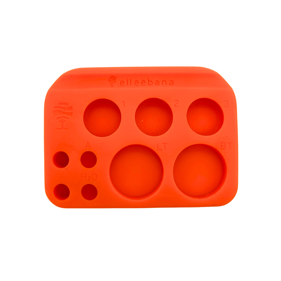 a set of Elleebana - ElleePALETTE plastic molds with four holes in them by Lash Tribe.