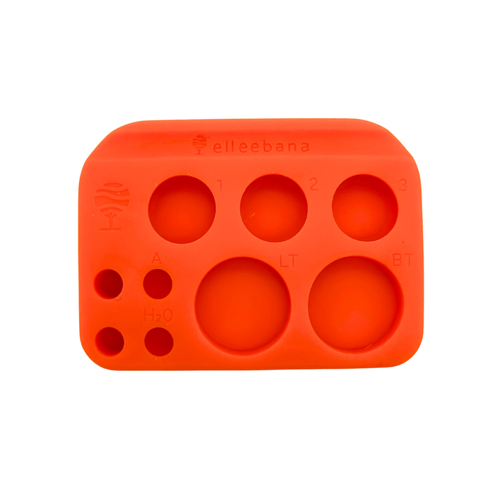 a set of Elleebana - ElleePALETTE plastic molds with four holes in them by Lash Tribe.