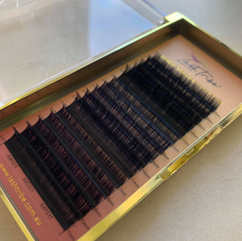 A set of MIXED Trays Classic and Volume Lashes in a gold box from Lash Tribe | Reduced to clear.