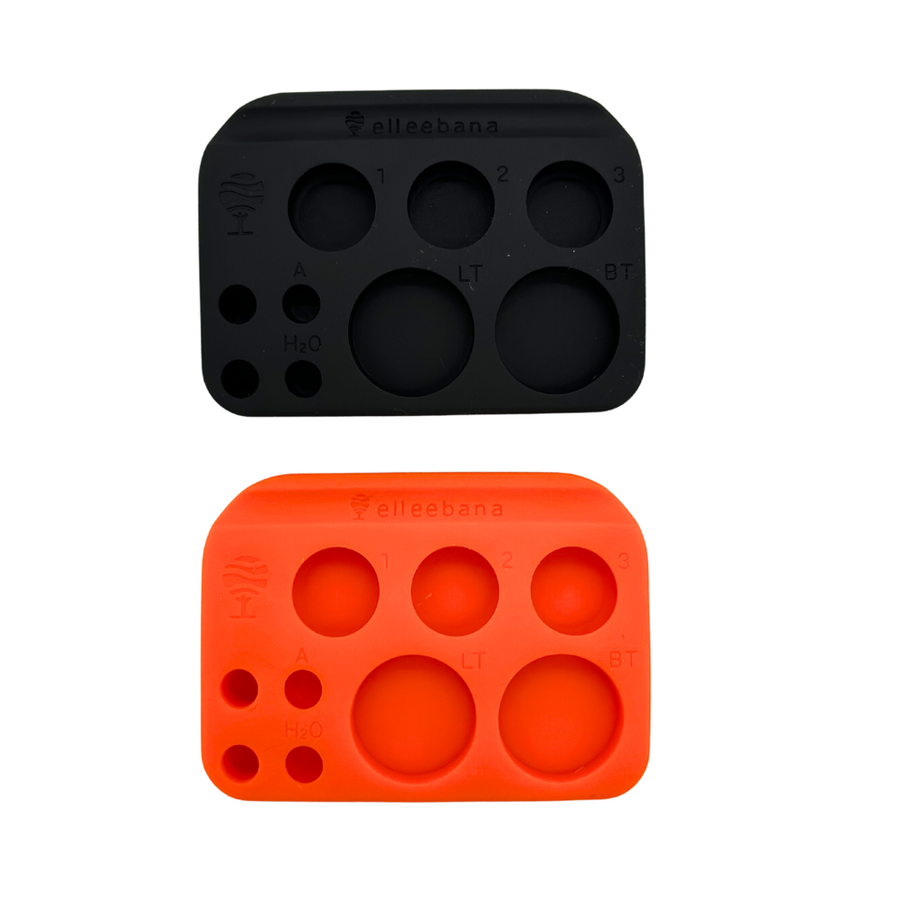 two Elleebana - ElleePALETTE plastic molds with four holes on them, produced by Lash Tribe.