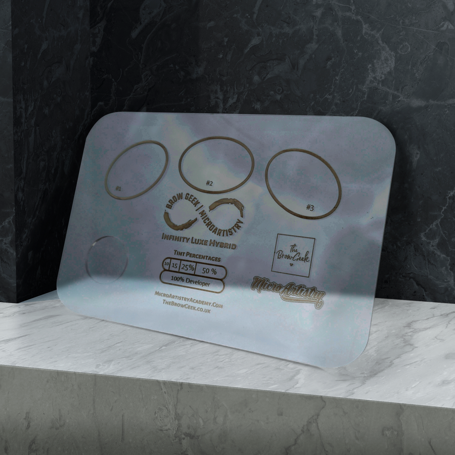 A Lash Tribe INFINITY LIFT & TINT PALETTE | Eyebrow and Lash Lifting sits on top of a marble counter.