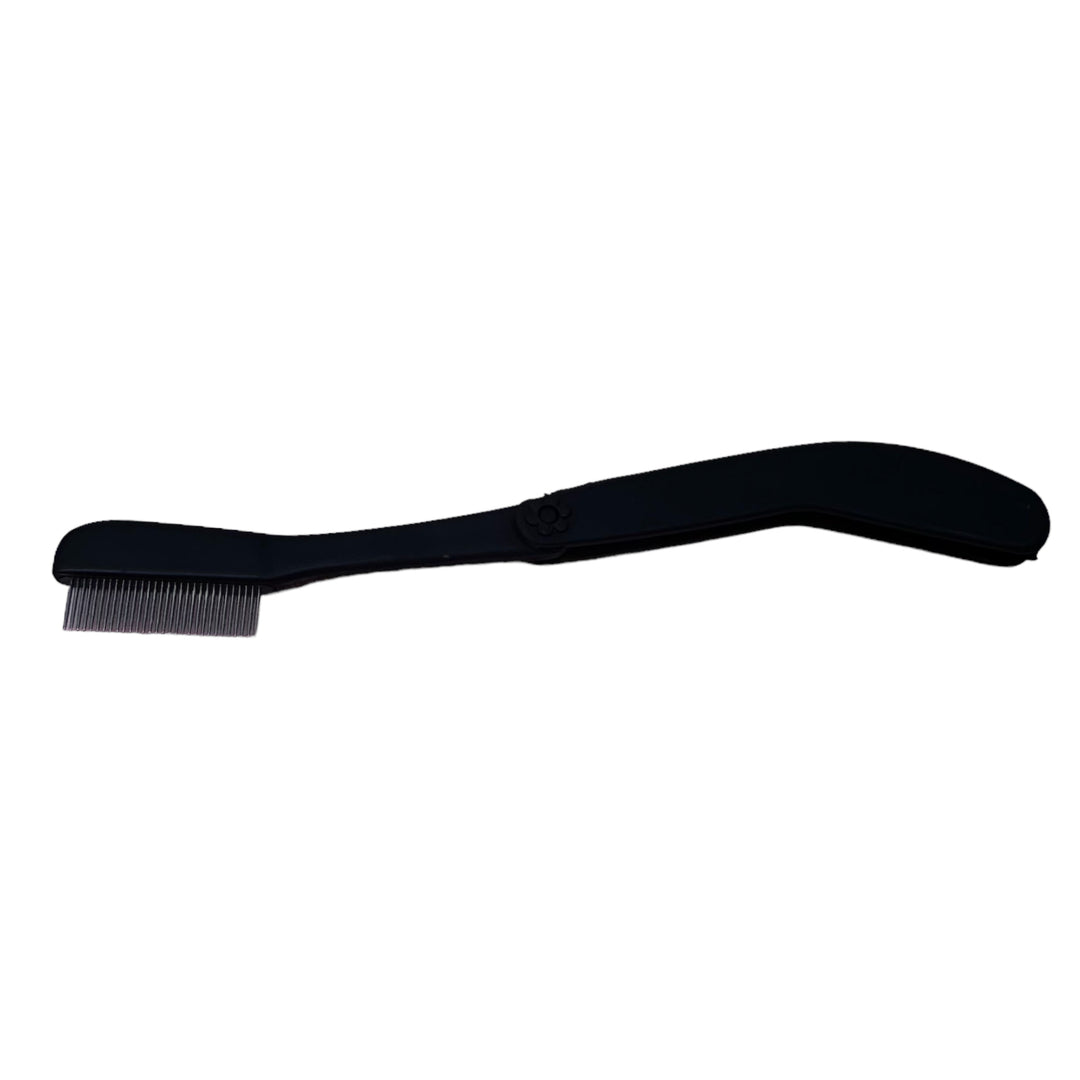 A black Lash Comb with a handle on a white background by Lash Tribe.