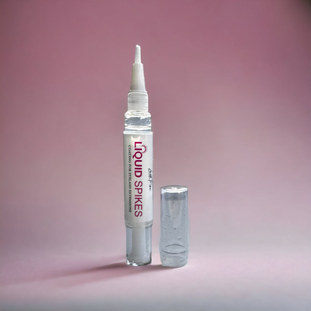 A clear bottle of Liquid Spikes | Lash Sealant for Wispy Lash Sets by Lash Tribe, with a white tip on it.
