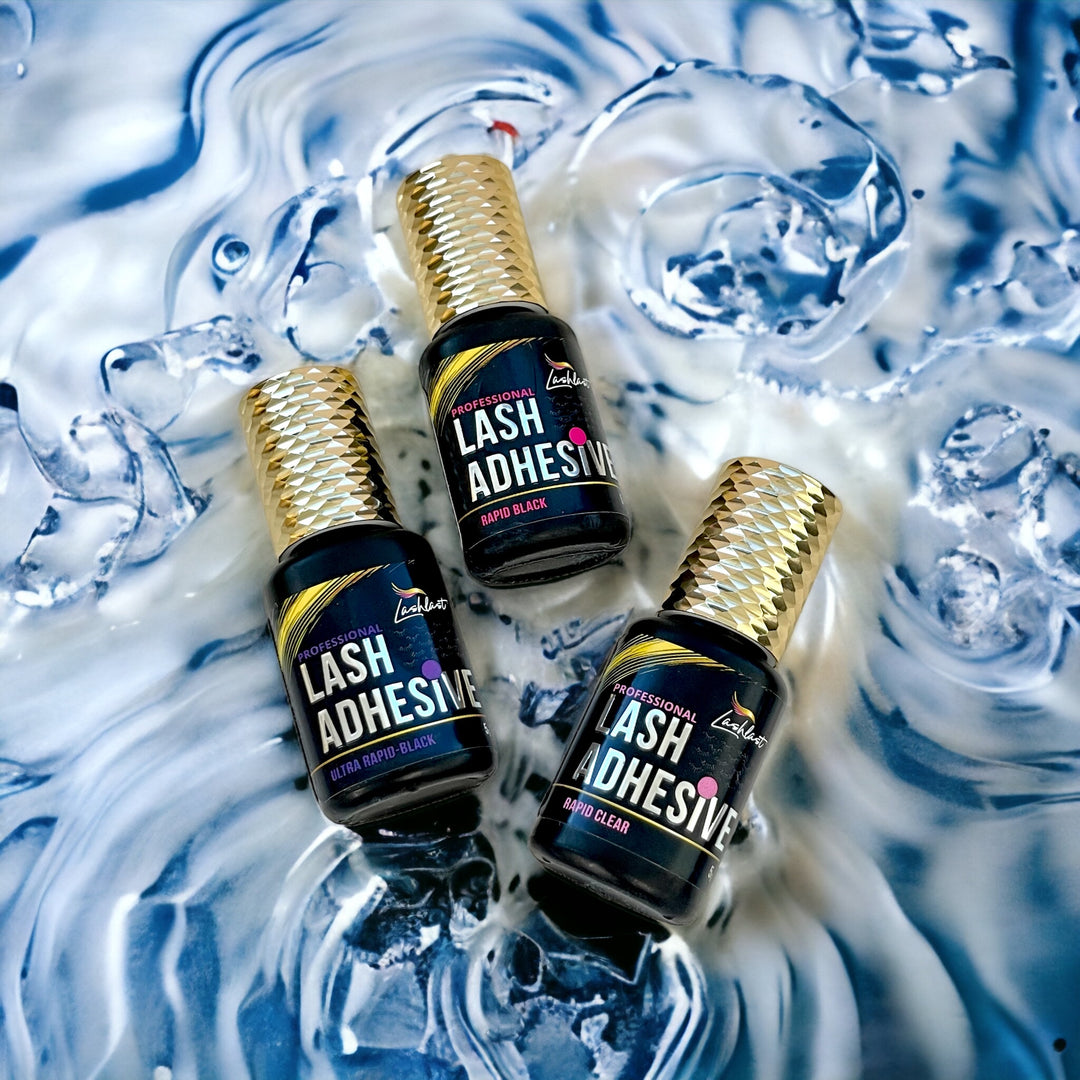 three bottles of Eyelash Adhesive Bundle from Lash Tribe™️ sitting on top of water.
