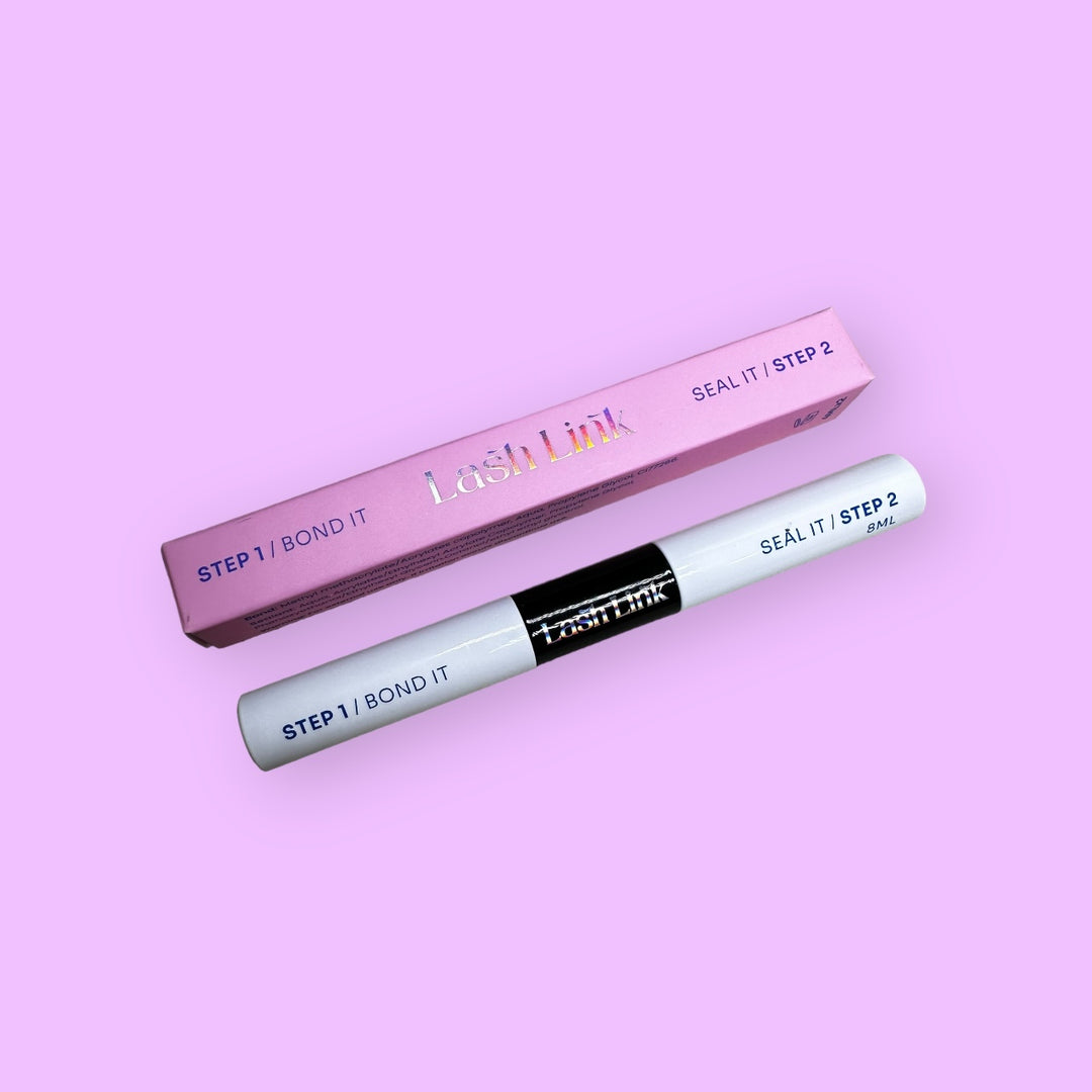 Lash Link's adhesive product, called Lash Link Bonder/Sealer Duo, includes a tube labeled "Step 1 | Bond It" and "Step 2 | Seal It." It's elegantly displayed next to a pink box on a purple background, ideal for seamless lash extensions.