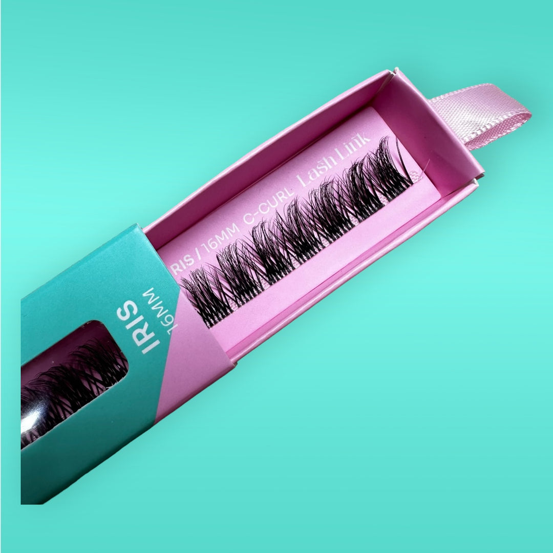 A teal and pink box labeled "Lash Link" contains a row of 16mm C-Curl false eyelashes against a turquoise background, perfect for those looking to create their own Eyelash Extension Home Studio with the Lash Link DIY Eyelash Extension Kit.