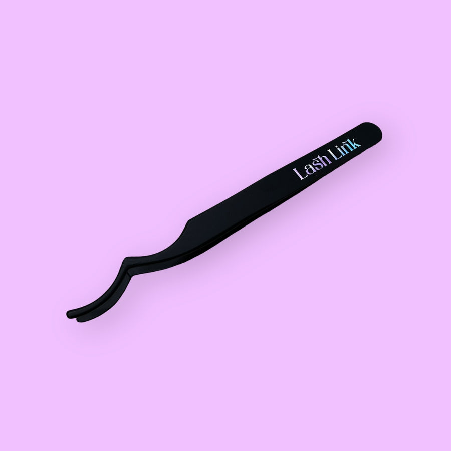 The Lash Link Applicator | Lash Segment Tweezer from Lash Link, in sleek black, is elegantly displayed against a light purple background, redefining lash application with precision and sophistication.