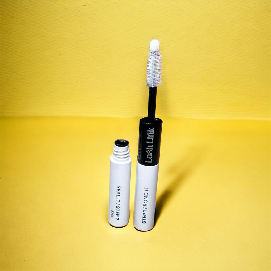 A "Lash Link Bonder/Sealer Duo" mascara tube with a white applicator brush stands against a vibrant yellow background, reminiscent of magic glue in lash extensions.