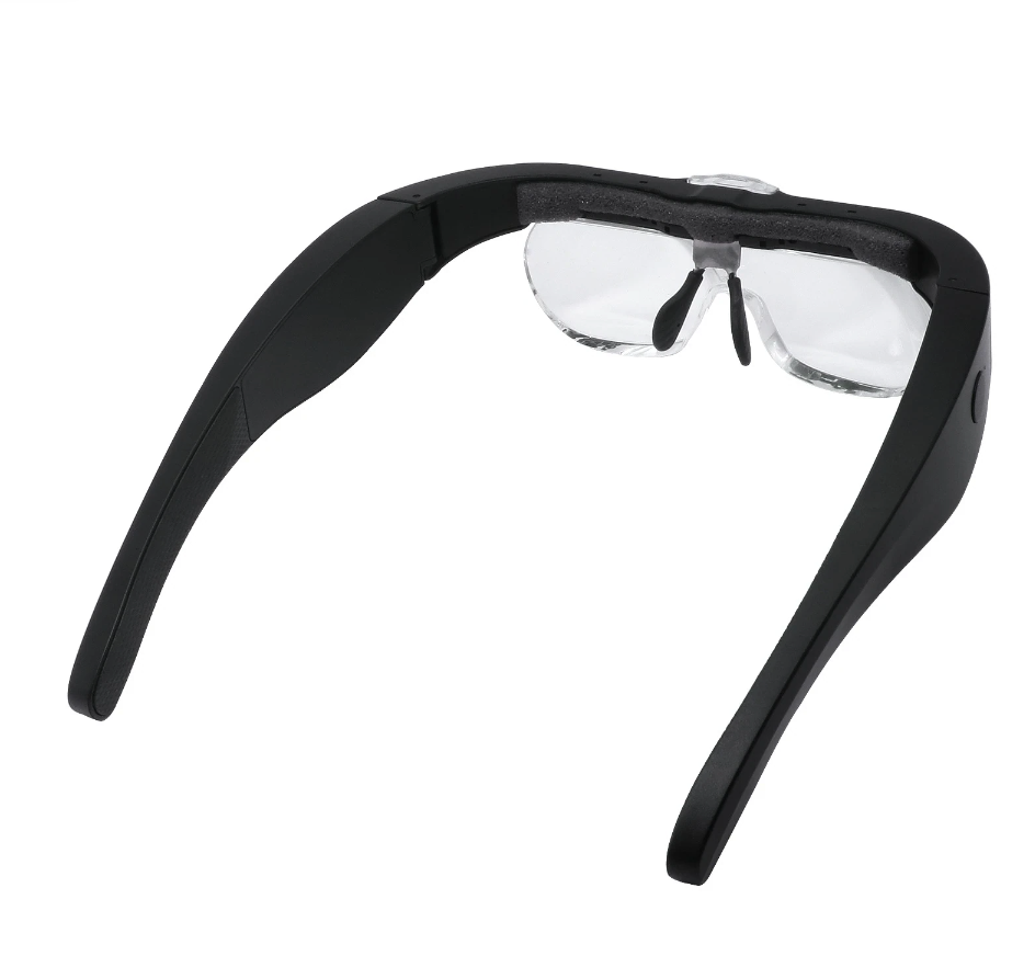 a pair of Magnifying Glasses with Led Light from Lash Tribe, with a black frame and clear lenses.