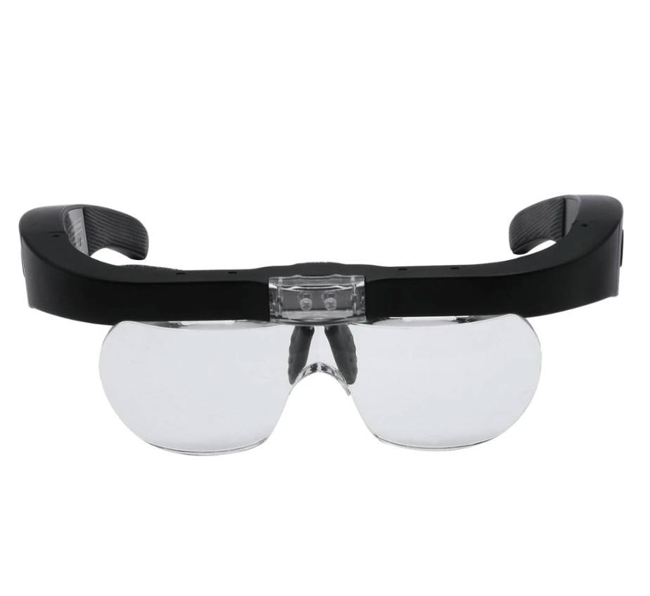 A pair of Magnifying Glasses with Led Light by Lash Tribe with a black frame and clear lenses.