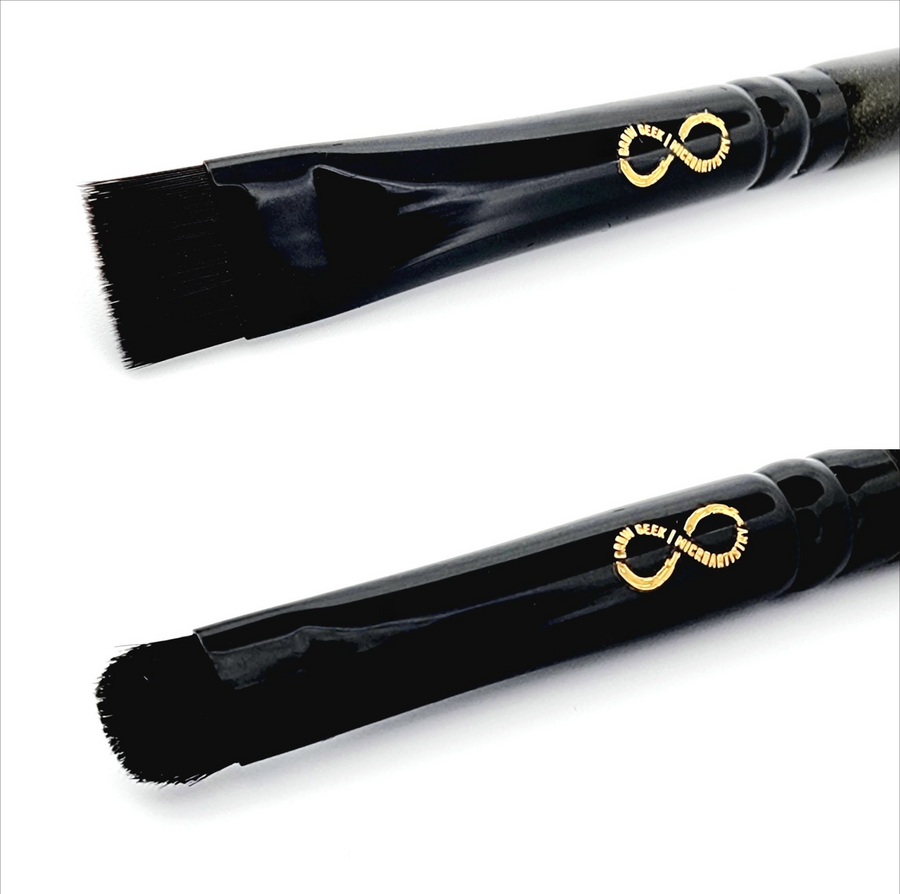 a black Infinity Buff & Blend Brush with a gold handle and a black handle.