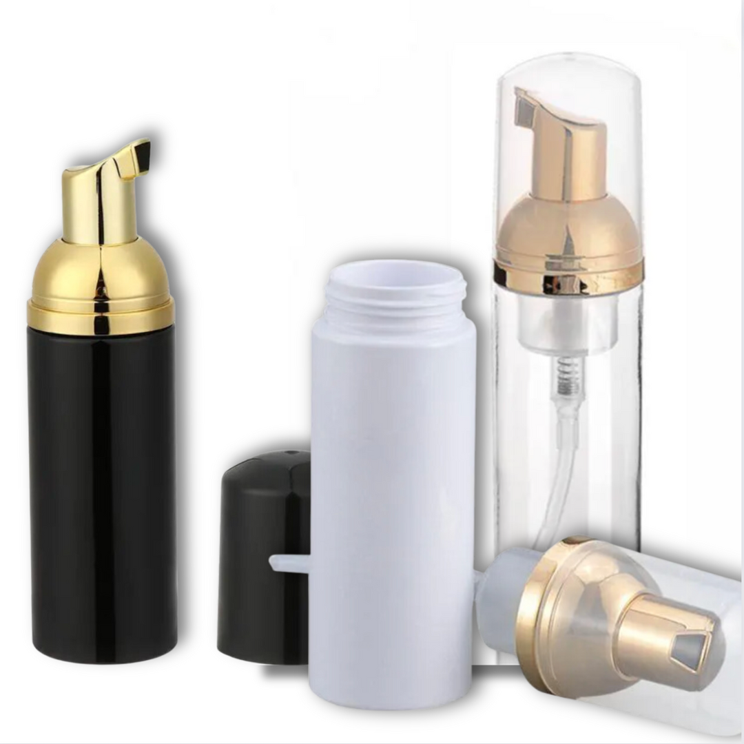 A black, white and gold 50ml Foaming Bottle with a gold lid by Lash Tribe.