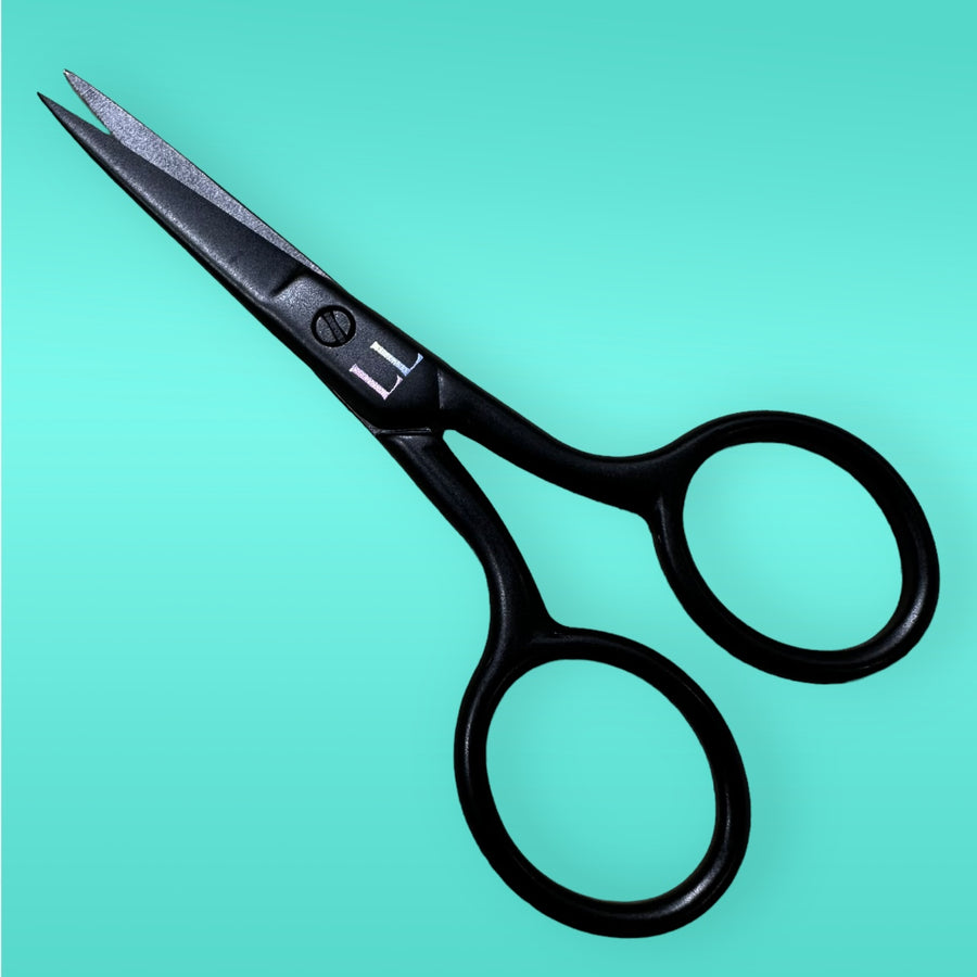 Lash Link Lash Scissors, featuring black rounded handles for precision cutting, rest elegantly on a teal background, ideal for lash artists seeking perfection.