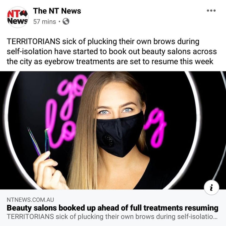 A woman is wearing a Lash Tribe Reusable Carbon Filter Mask and Carbon Filters on her face.