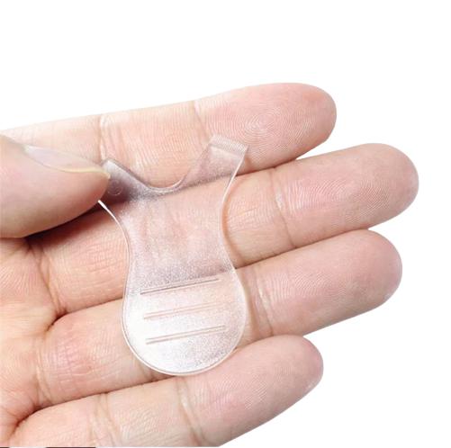 A person holding a small Elleebana Tree Tool | Y Comb for Lash Lifting in their hand.