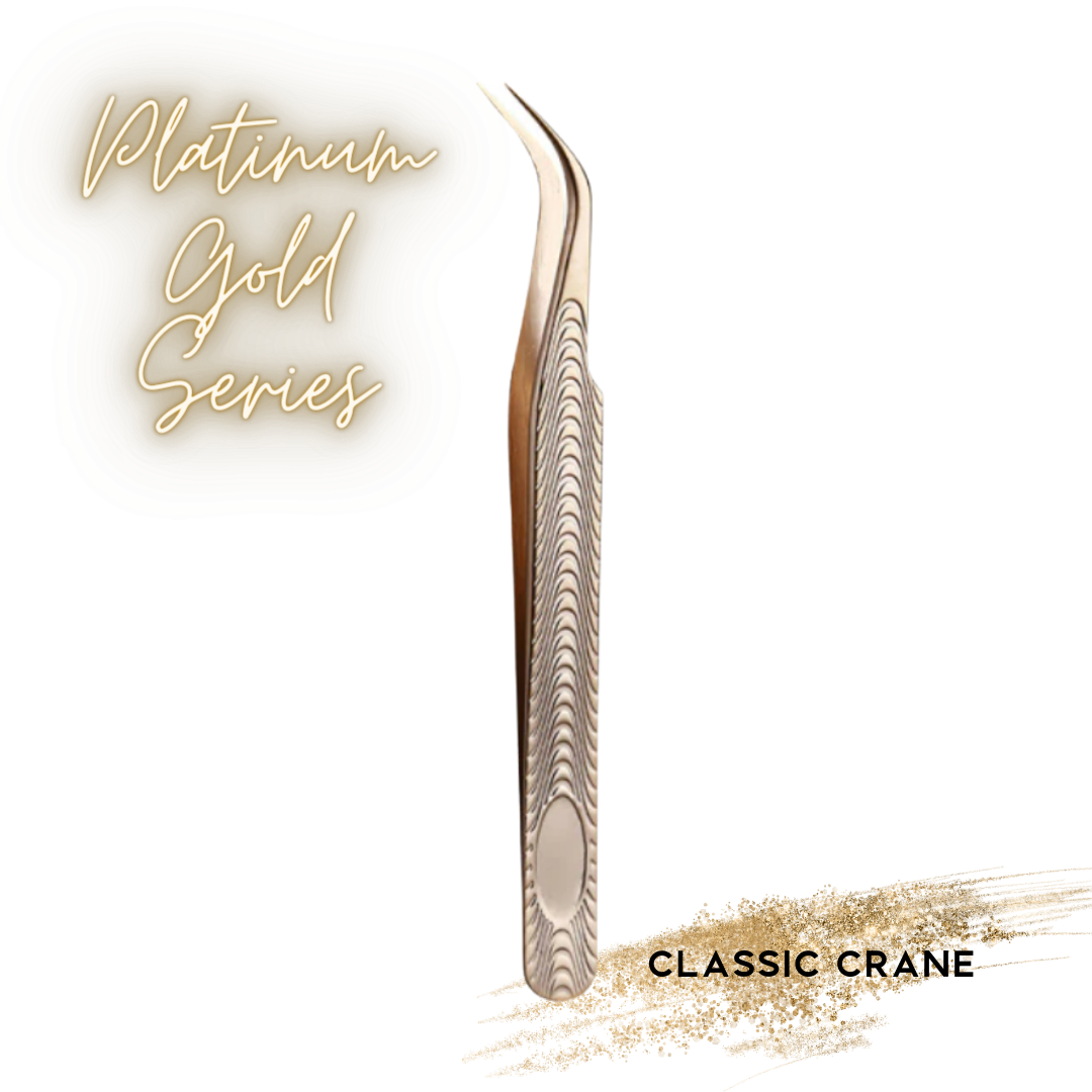 A pair of hand-tested Platinum Gold Series - The Ultimate Tweezer Collection brow tweezers with the words 'classic crane' by lash tribe.