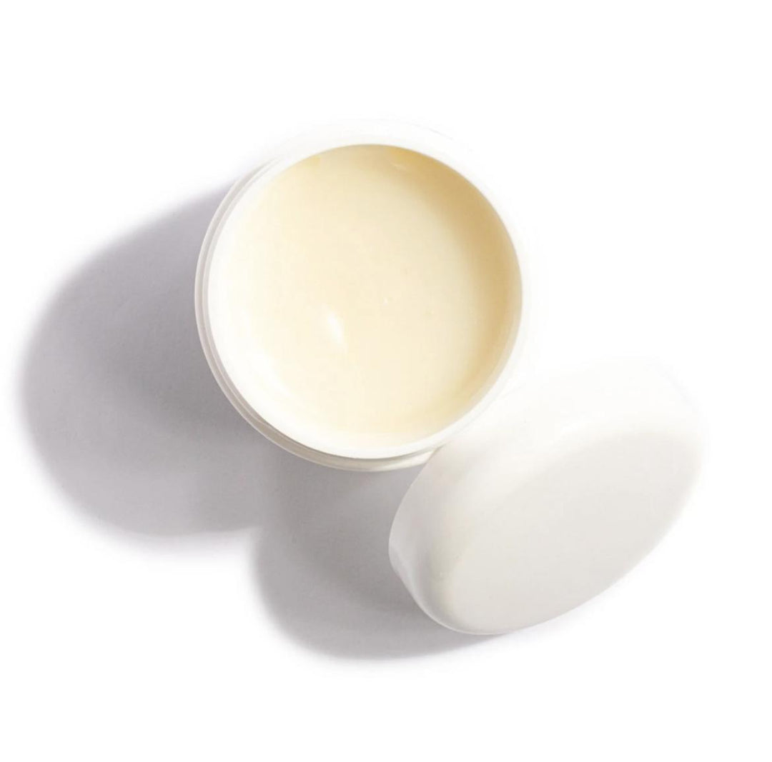 An Ellee Shield | Belma Shield Protective Balm | Elleebana jar with a lid on a white surface.