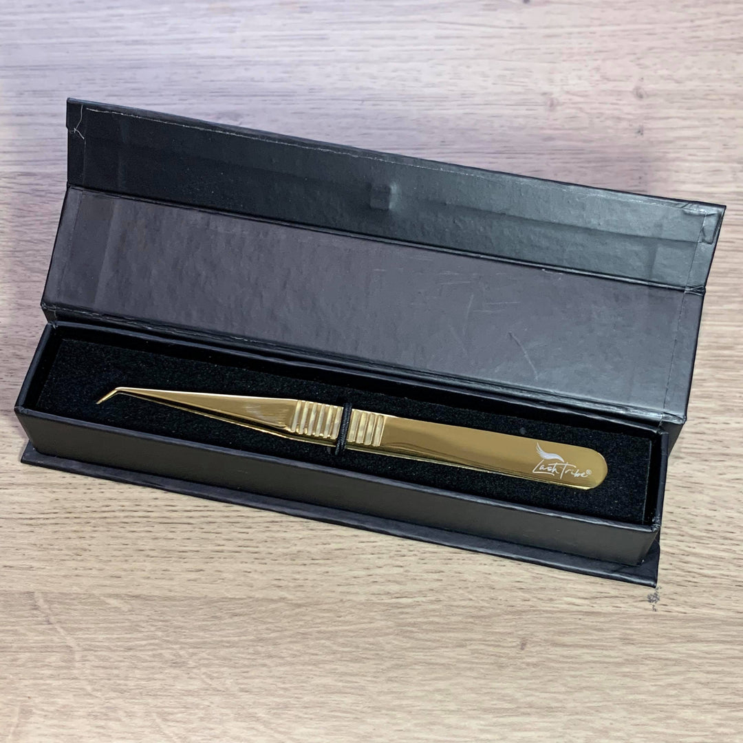 A Julia's Fave Volume Tweezers in a black box by Lash Tribe.