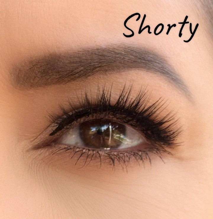 A woman's eye with long lashes, wearing the Silk Magnetic Lashes & Liner Kit by Lash Tribe, and the words shorty.