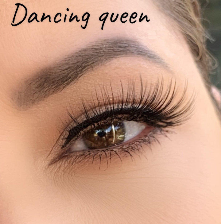 A woman's eye with long lashes wearing the Silk Magnetic Lashes & Liner Kit by Lash Tribe and the words dancing queen.