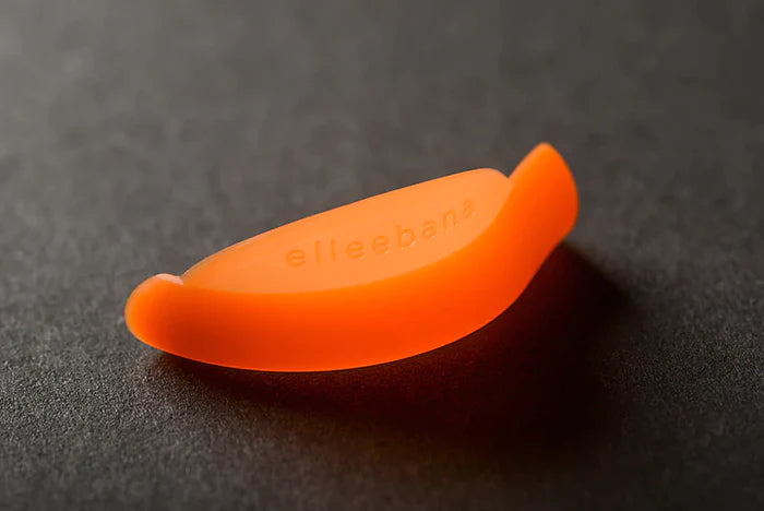 an Elleebana Flex Rods for Lash Lifting on a black surface.