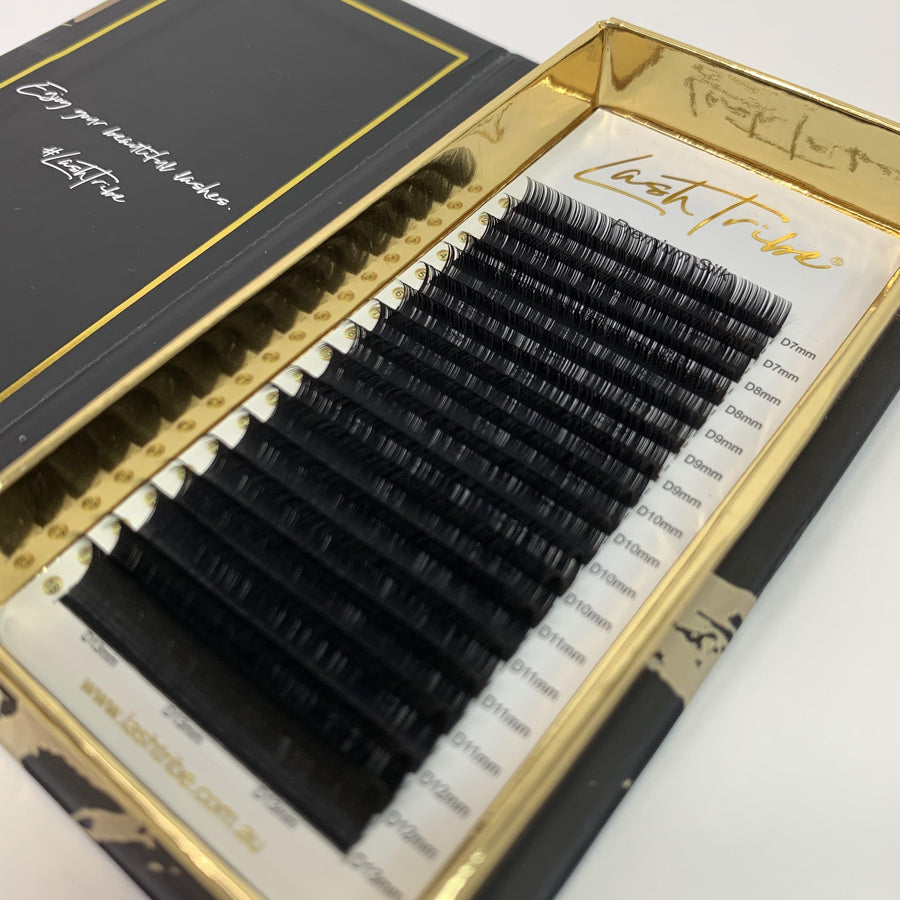 A set of Lash Tribe 0.03 Volume Lashes organized by length in a professional packaging.