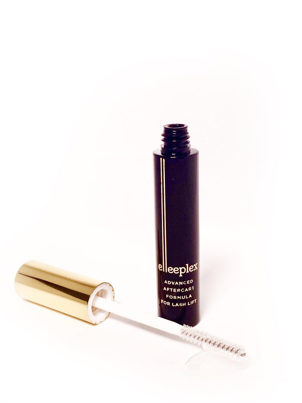 Elleebana's Elleeplex Advanced After Care Formula for Lash Lift and a brush on a white surface.