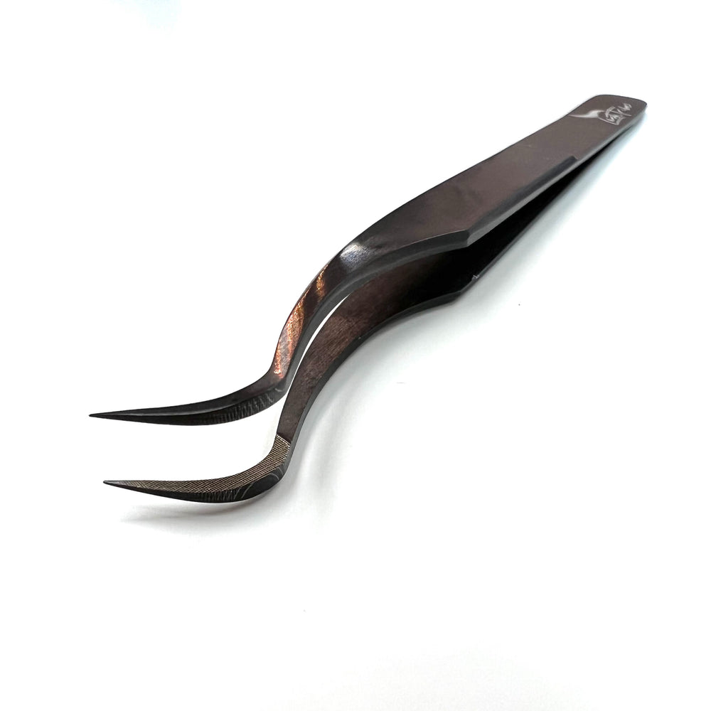 a pair of Lash Tribe Black Beauty Nano Tips | Russian Volume Tweezer Collection on a white surface.