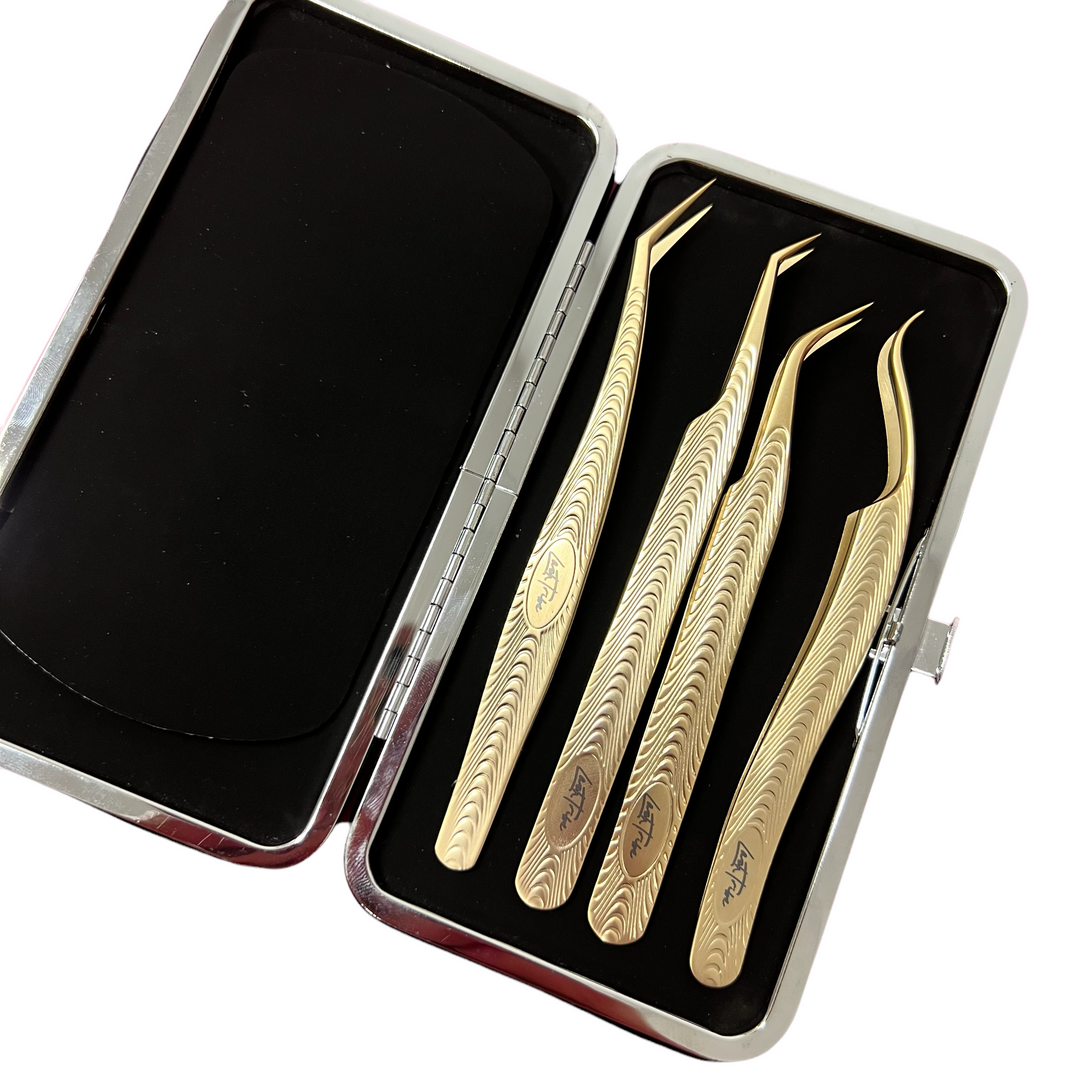 A stunning set of Platinum Gold Series - The Ultimate Tweezer Collection by lash tribe.