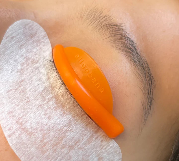 a woman's eye is being treated with an Elleebana Flex Rods for Lash Lifting eye patch.