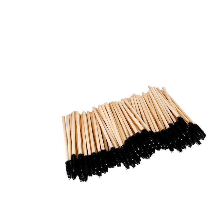 A bunch of Lash Tribe's Bamboo Mascara Wands on a white background.