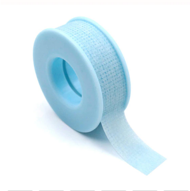 A roll of Blue Sensitive Tape by Lash Tribe on a white background.
