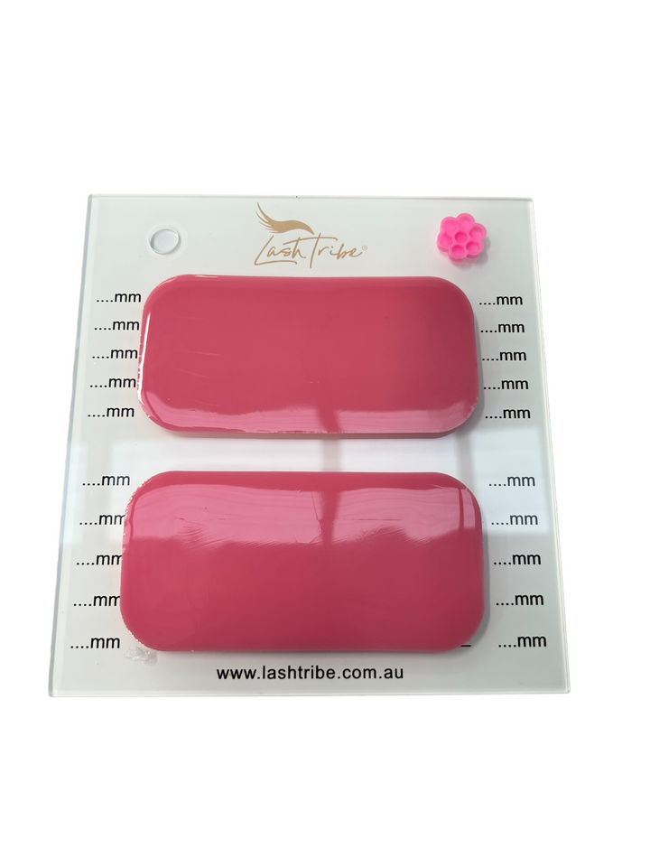 A pair of Mega Lash Tile | Left & Right Handed nail polishes in a plastic container. (Brand: Lash Tribe)