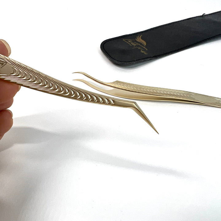 a person holding a pair of Classic Duo - Lash Tweezers | Pickup and Isolation by Lash Tribe.