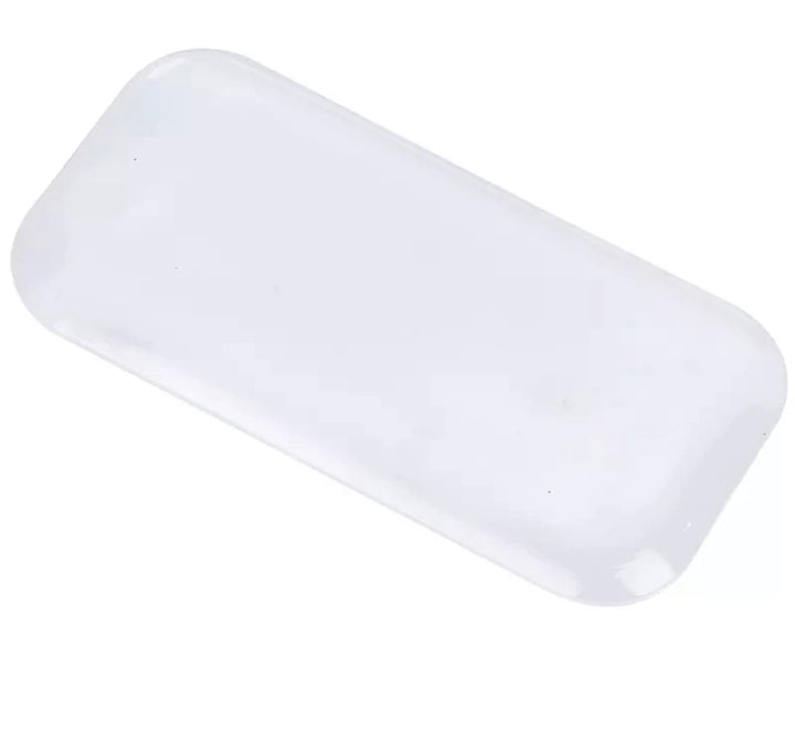 a Lash Tribe Silicone Lash Pad on a white surface.