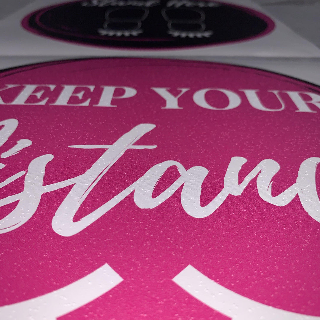 a pink and white Social Distancing Floor Sticker with the words keep your stance by Lash Tribe.