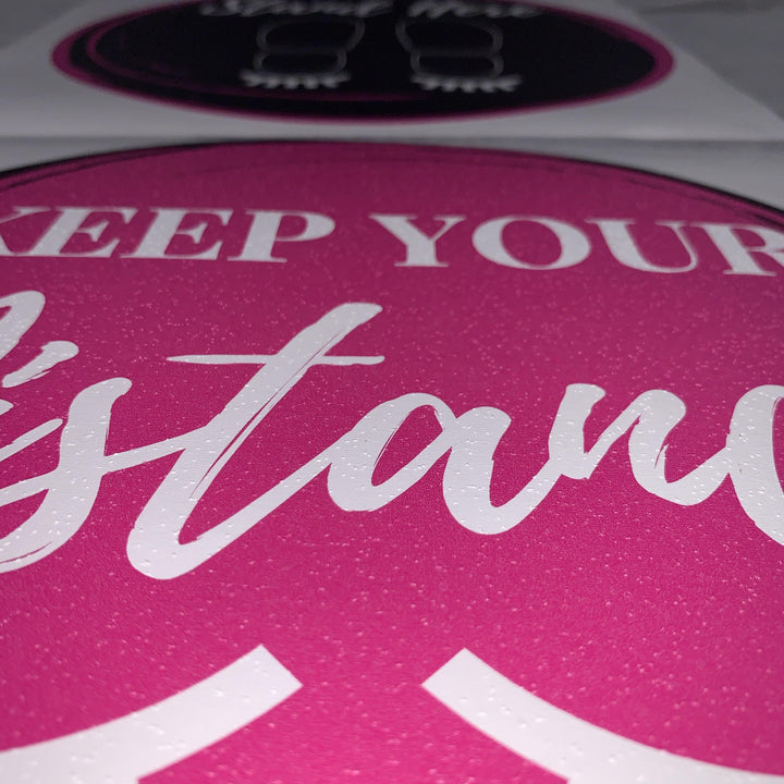 a pink and white Social Distancing Floor Sticker with the words keep your stance by Lash Tribe.