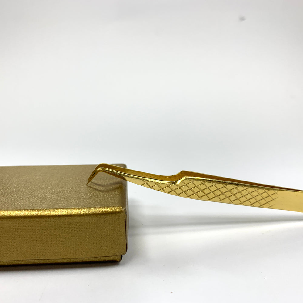 a Diamond Russian Volume Tweezers by Lash Tribe in a box.