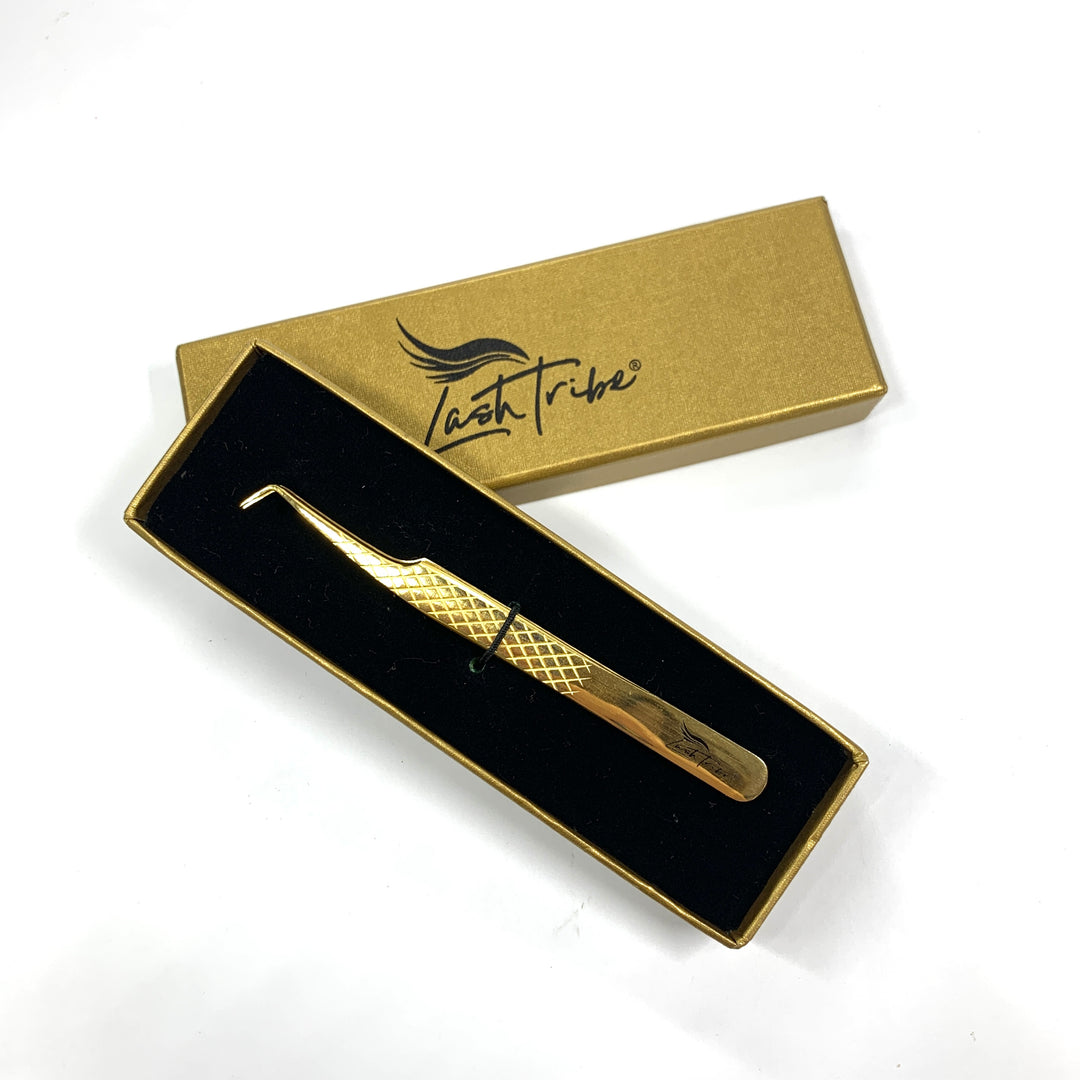 a Diamond Russian Volume Tweezers from Lash Tribe in a gold box.