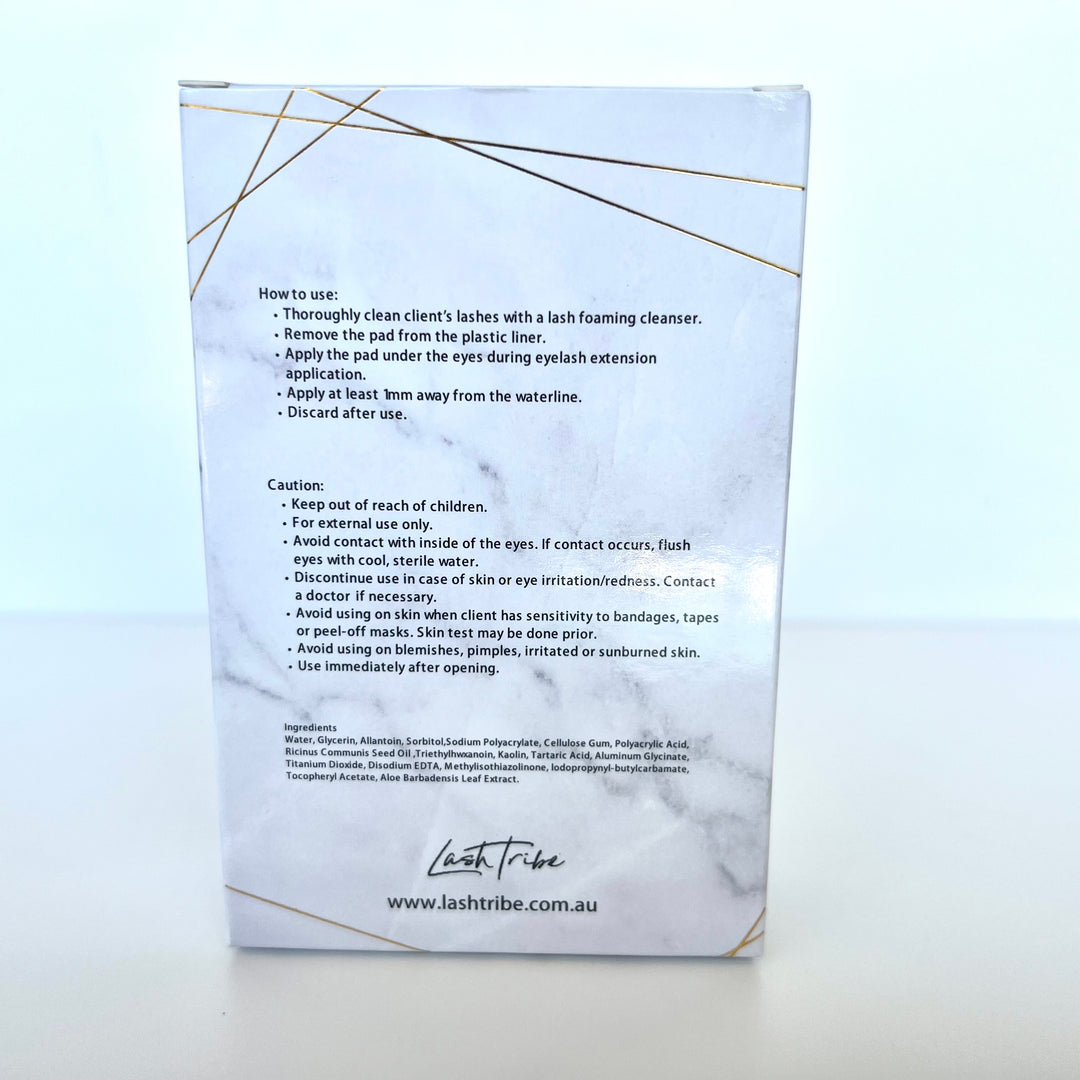 a white box with a gold label on it containing Lash Tribe Under Eye Gel Pads.