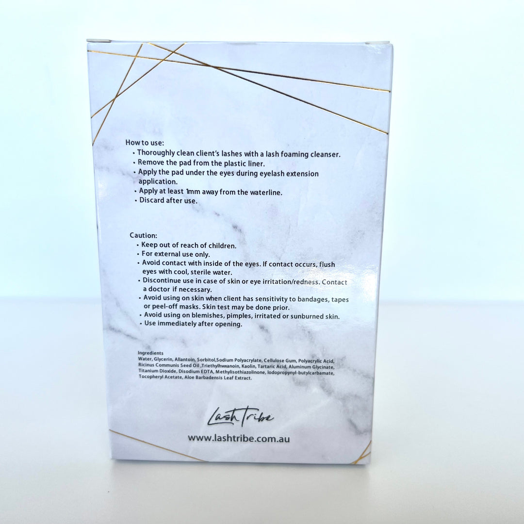 a white box with a gold label on it containing Lash Tribe Under Eye Gel Pads.