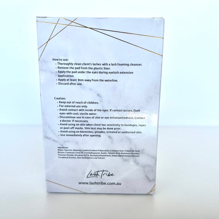 a white box with a gold label on it containing Lash Tribe Under Eye Gel Pads.