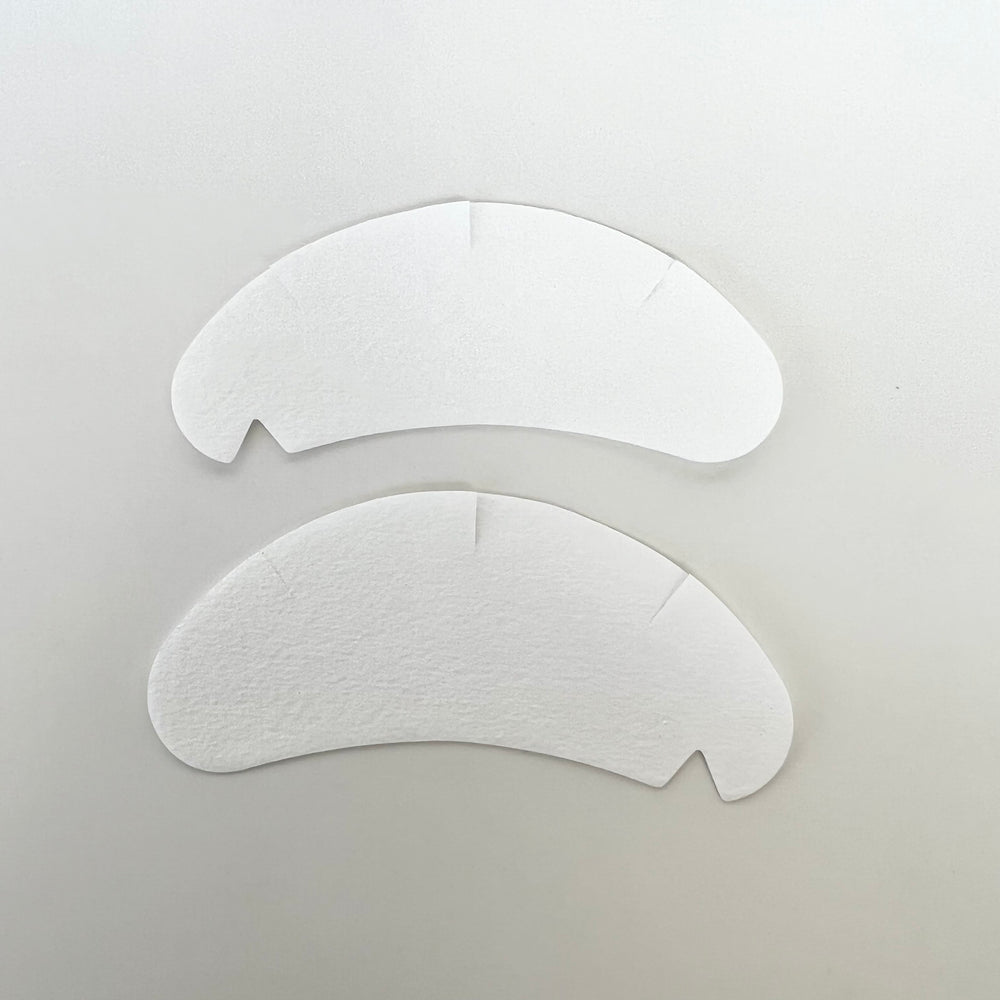 two Lash Tribe Under Eye Gel Pads on a white surface.