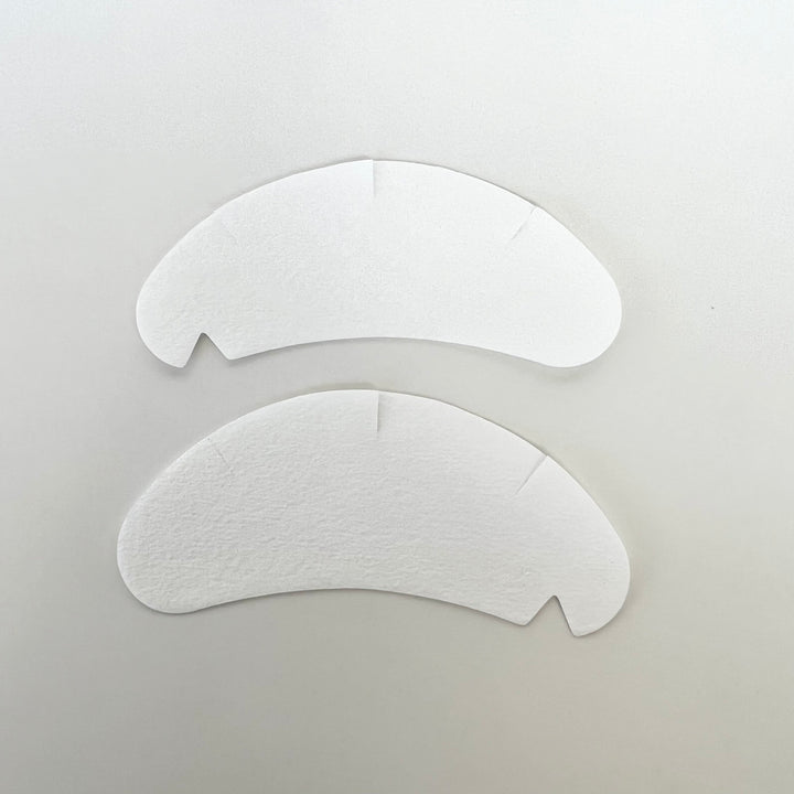 two Lash Tribe Under Eye Gel Pads on a white surface.