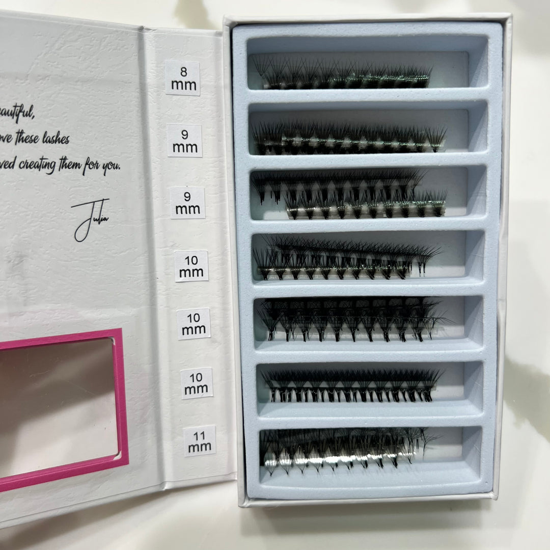 a box of Lash Tribe Ultra Speed Premade Volume Fans | Long Stem | Ultra Black false eyelashes in a pink box.