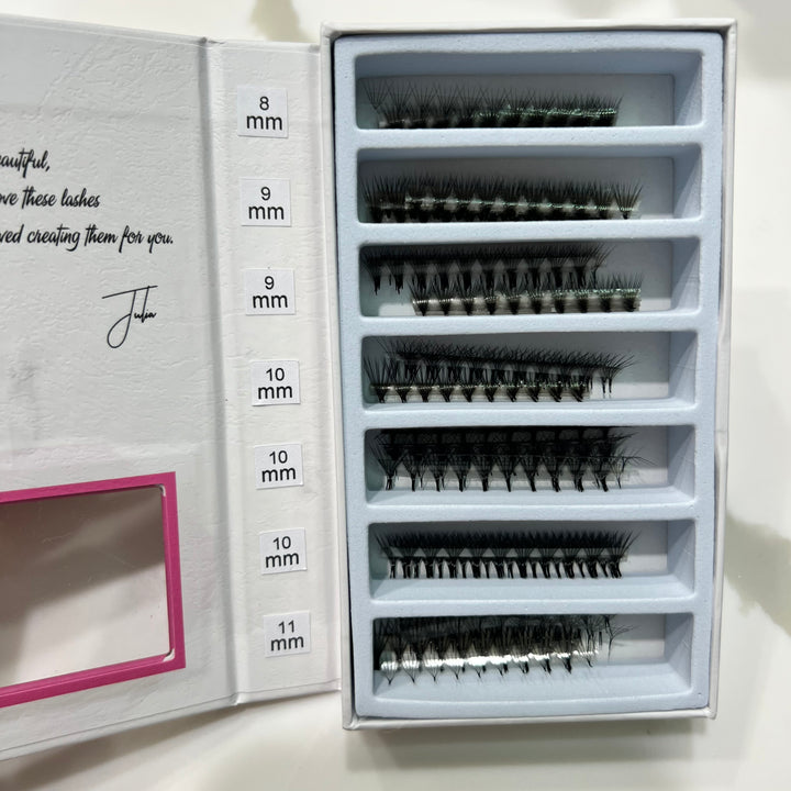 a box of Lash Tribe Ultra Speed Premade Volume Fans | Long Stem | Ultra Black false eyelashes in a pink box.