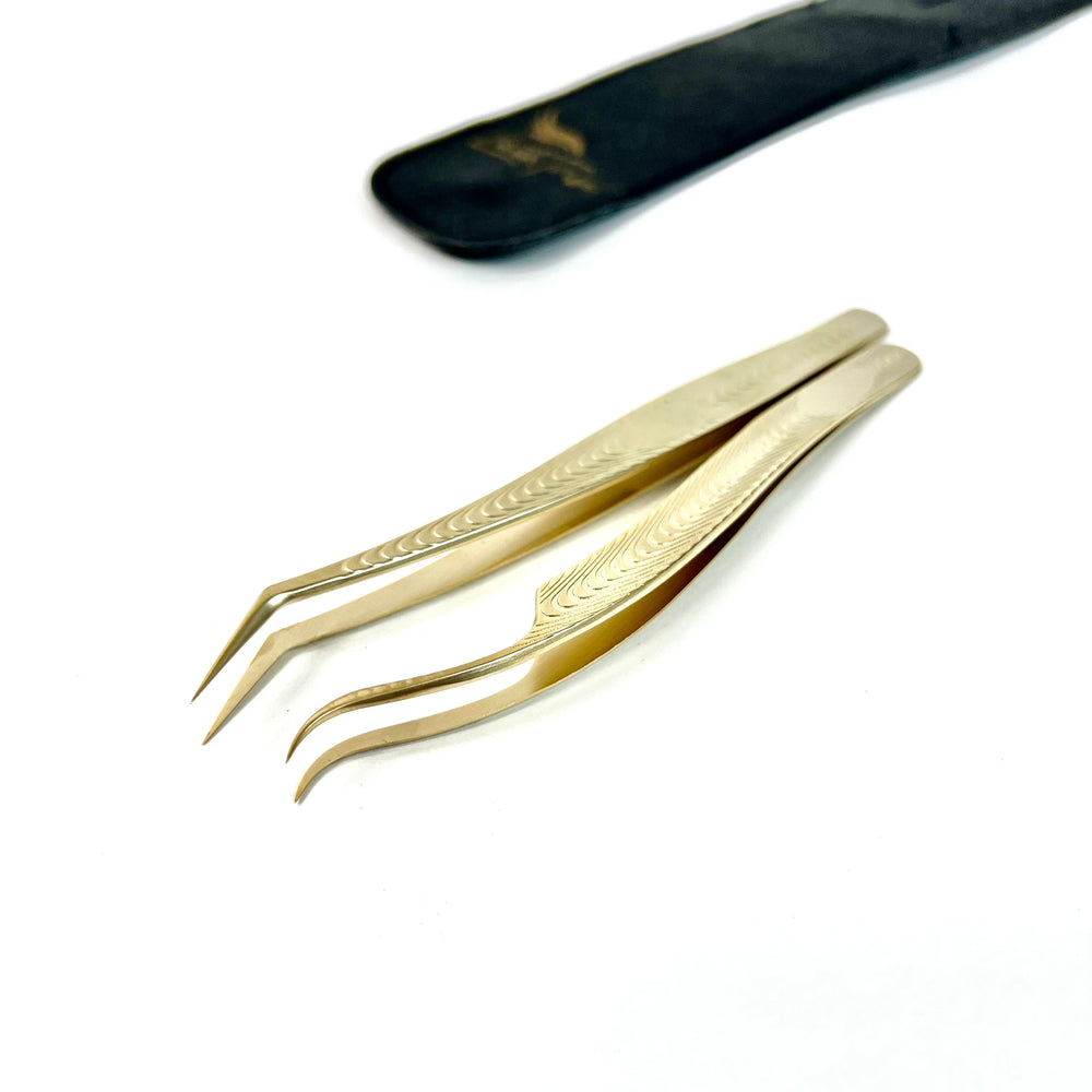 A pair of Classic Duo - Lash Tweezers | Pickup and Isolation by Lash Tribe on a white surface.