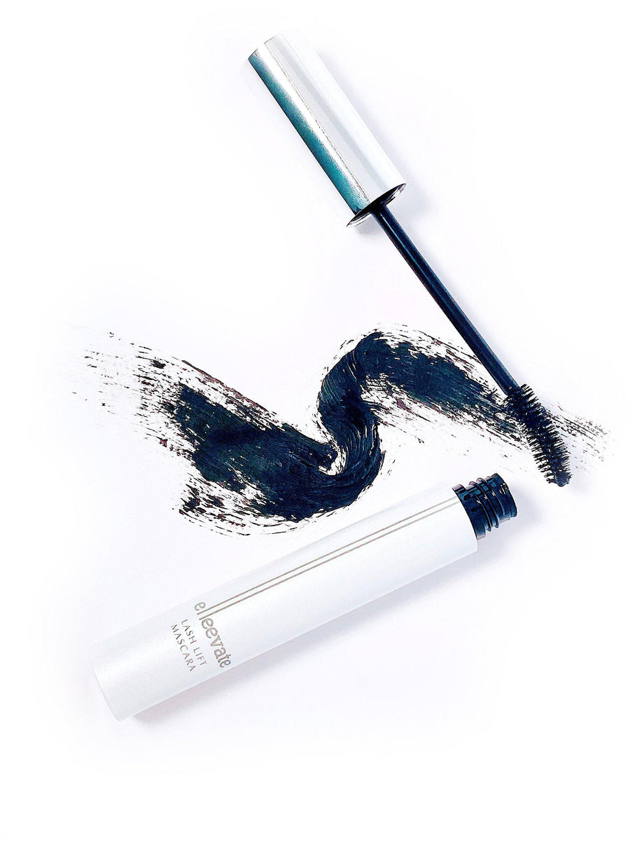 An Elleebana Elleevate Lash Lift Mascara with black smudges on a white background, perfect for salon sales and offering wholesale pricing.